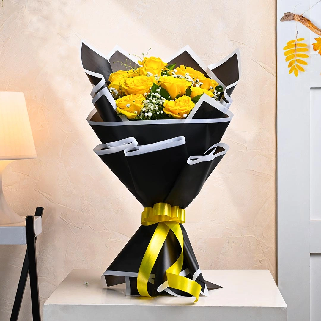 Mesmerizing Yellow Flowers Roses In Black Paper